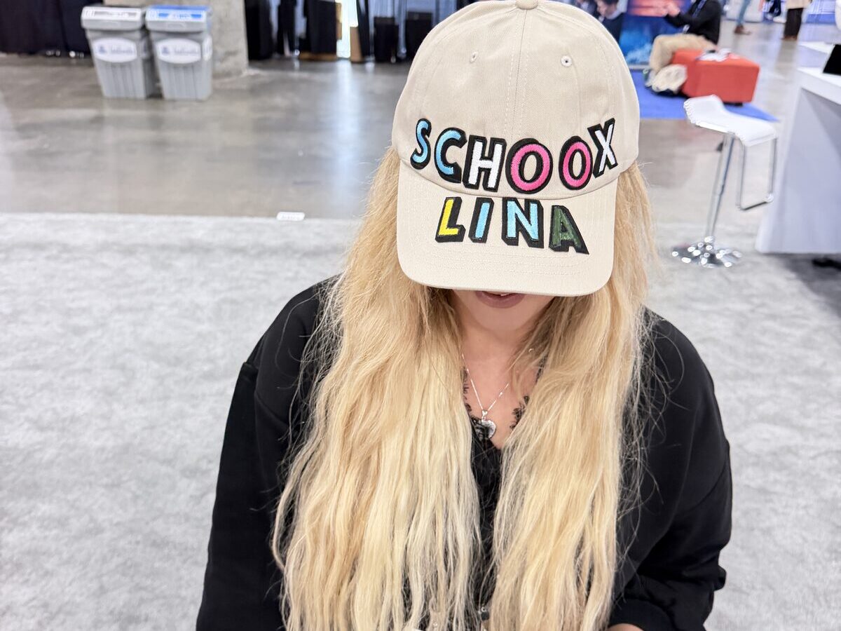 Custom decorated cap photographed on a plain surface